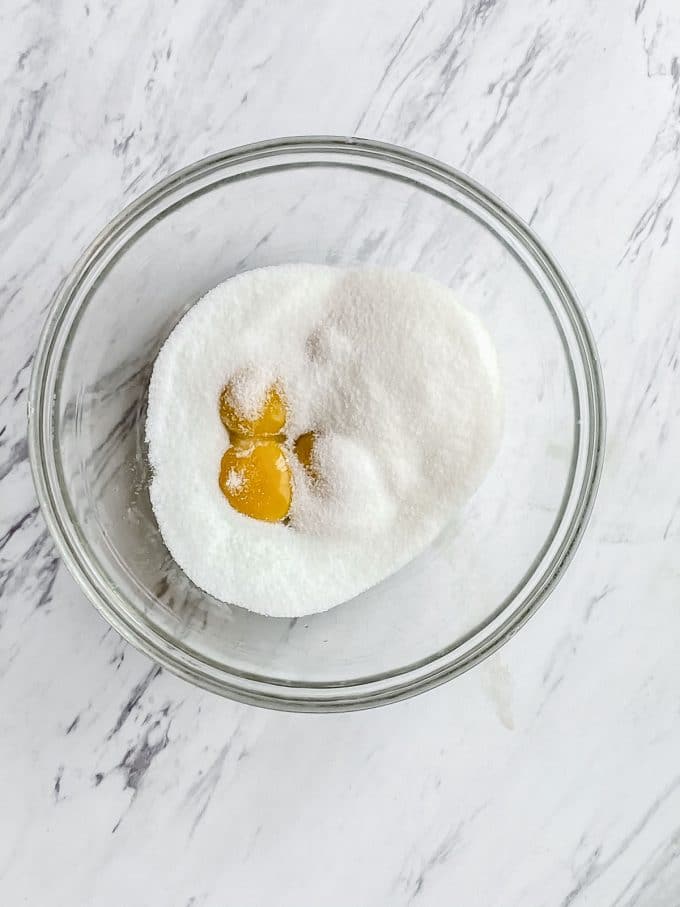 A bowl with egg yolks and sugar