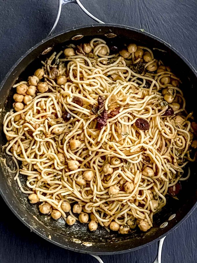 Pasta and chickpeas cooking in a pan
