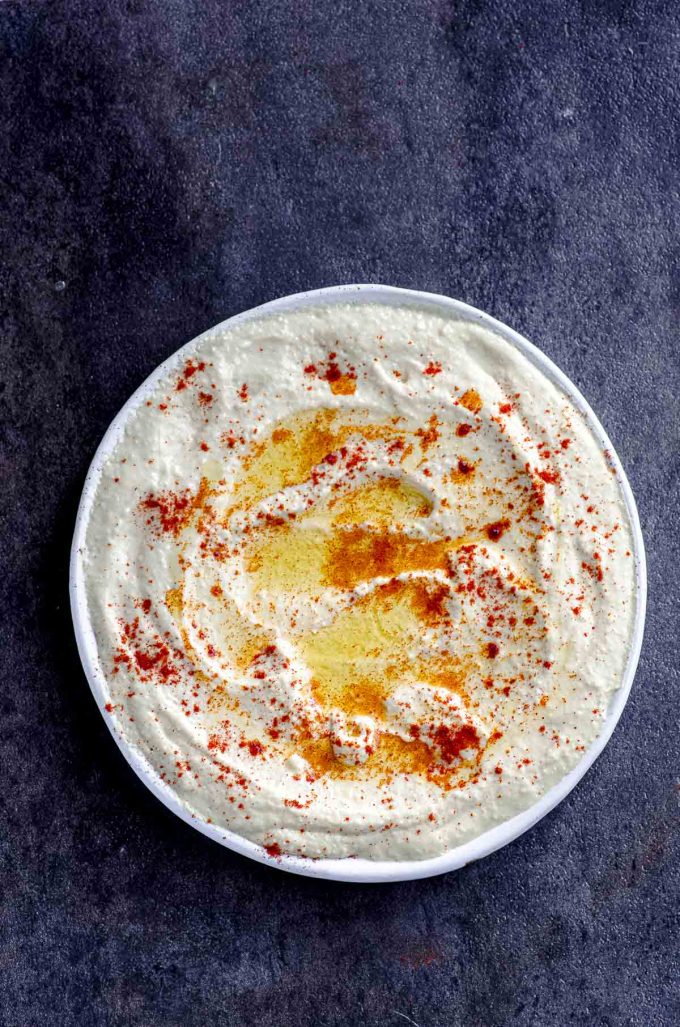 Hummus plate with olive oil and paprika