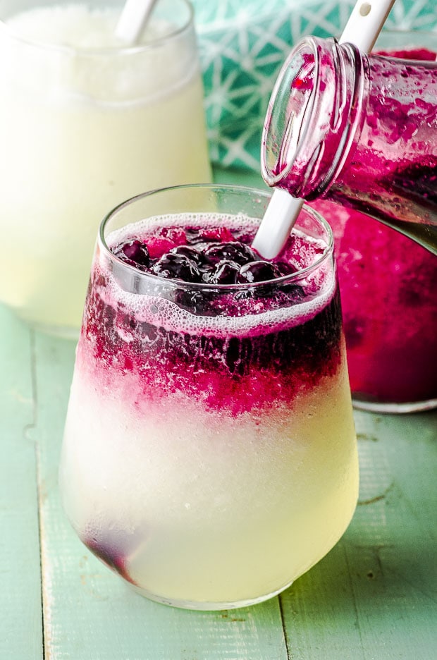 close up view of a glass of frozen blueberry lemonade 