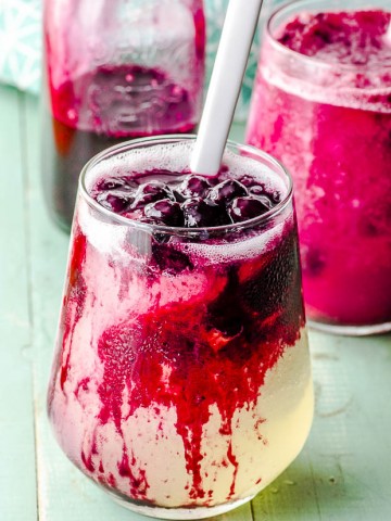 close up view of a glass of frozen blueberry lemonade