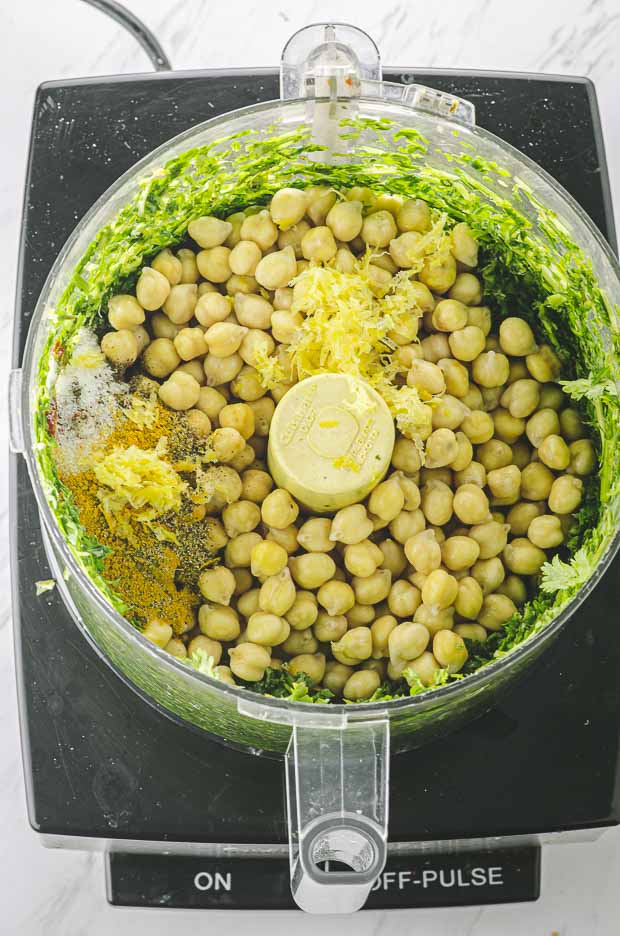 Herbs, chickpeas and lemon zest in a food processor
