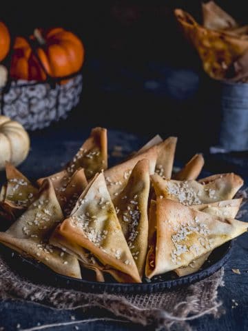 A plate full of crunchy appetizers filled with pumpkin