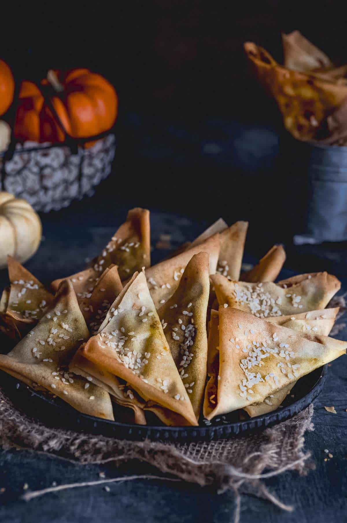A plate full of crunchy appetizers filled with pumpkin