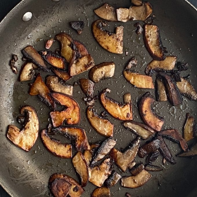 Portabella mushrooms cooked in a skillet