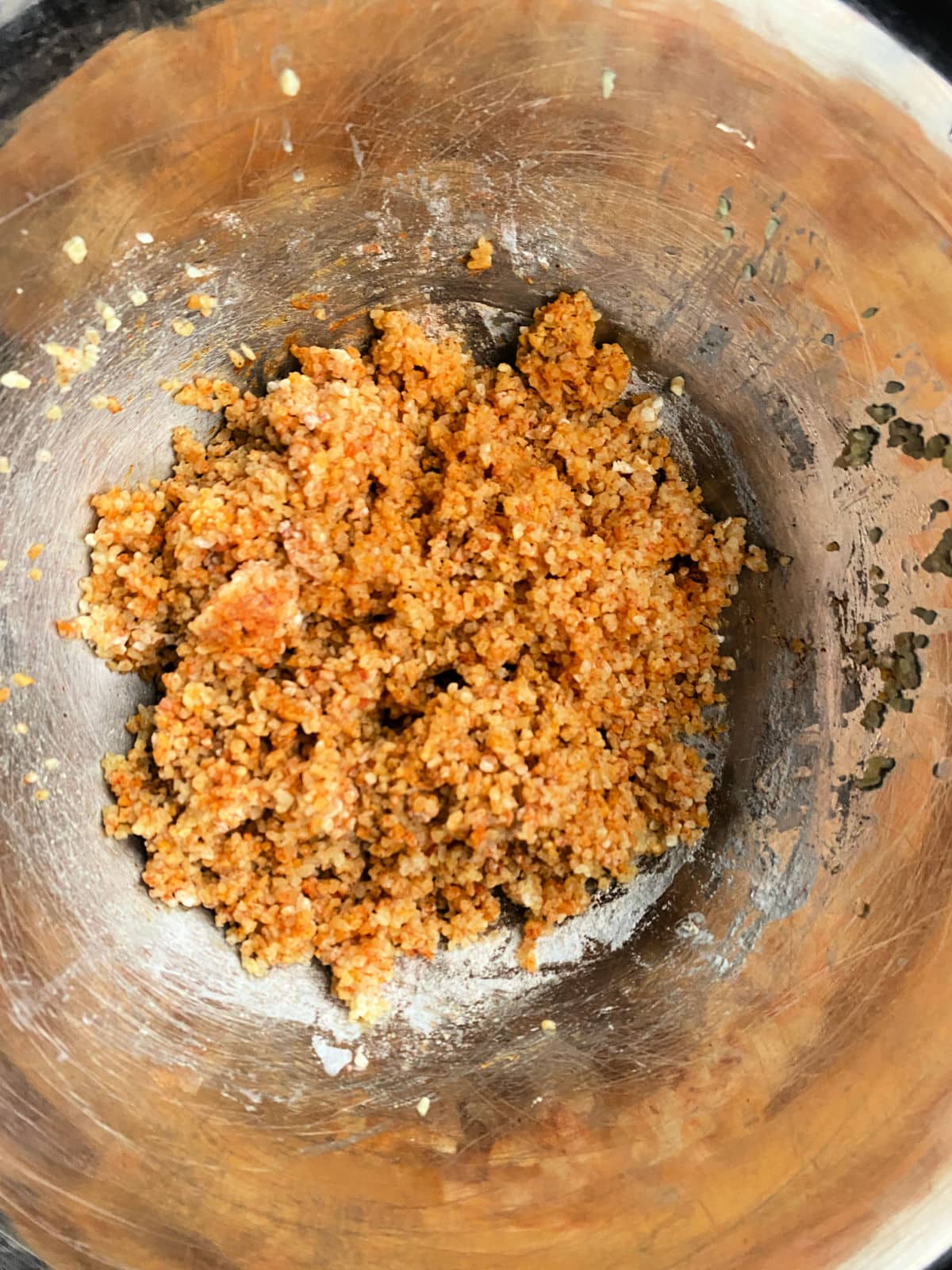 Bulgur, chicpeas and spices mixed into a bowl
