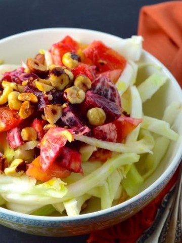 Side view of a fennel salad with blood oranges and hazelnuts