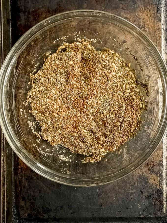 Flax and chia seeds soaking in a glass bowl