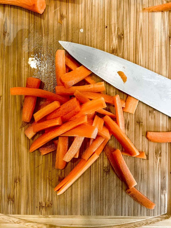 Carrots sticks on a wood board