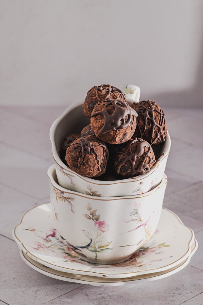 Date balls in two stacked tea cups
