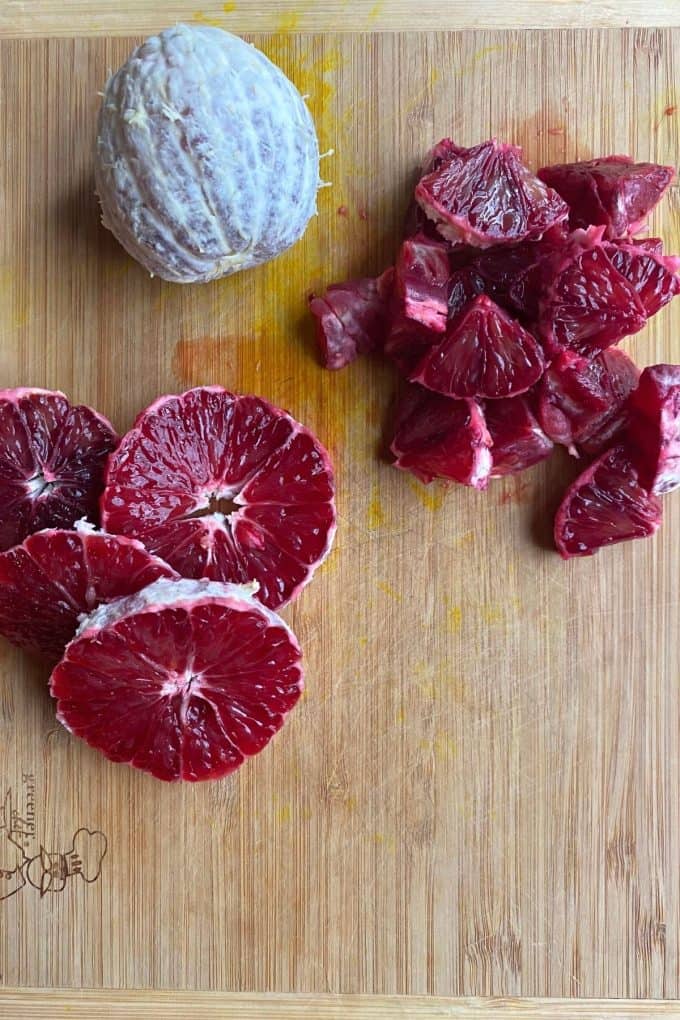 An overhead view of blood oranges peeled and sliced