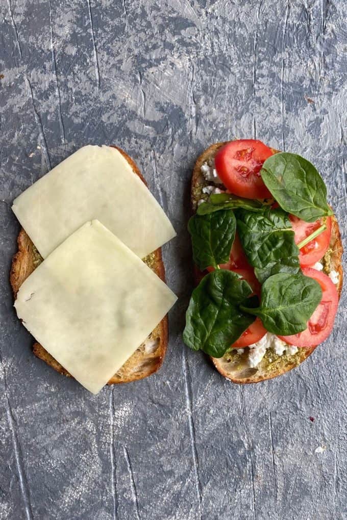 Sourdough slices with muenster cheese, tomato slices and spinach