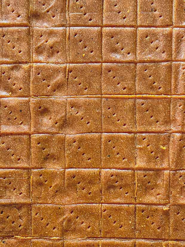 Close up of Gluten-Free Falafel crackers dough rolled and scored into squares
