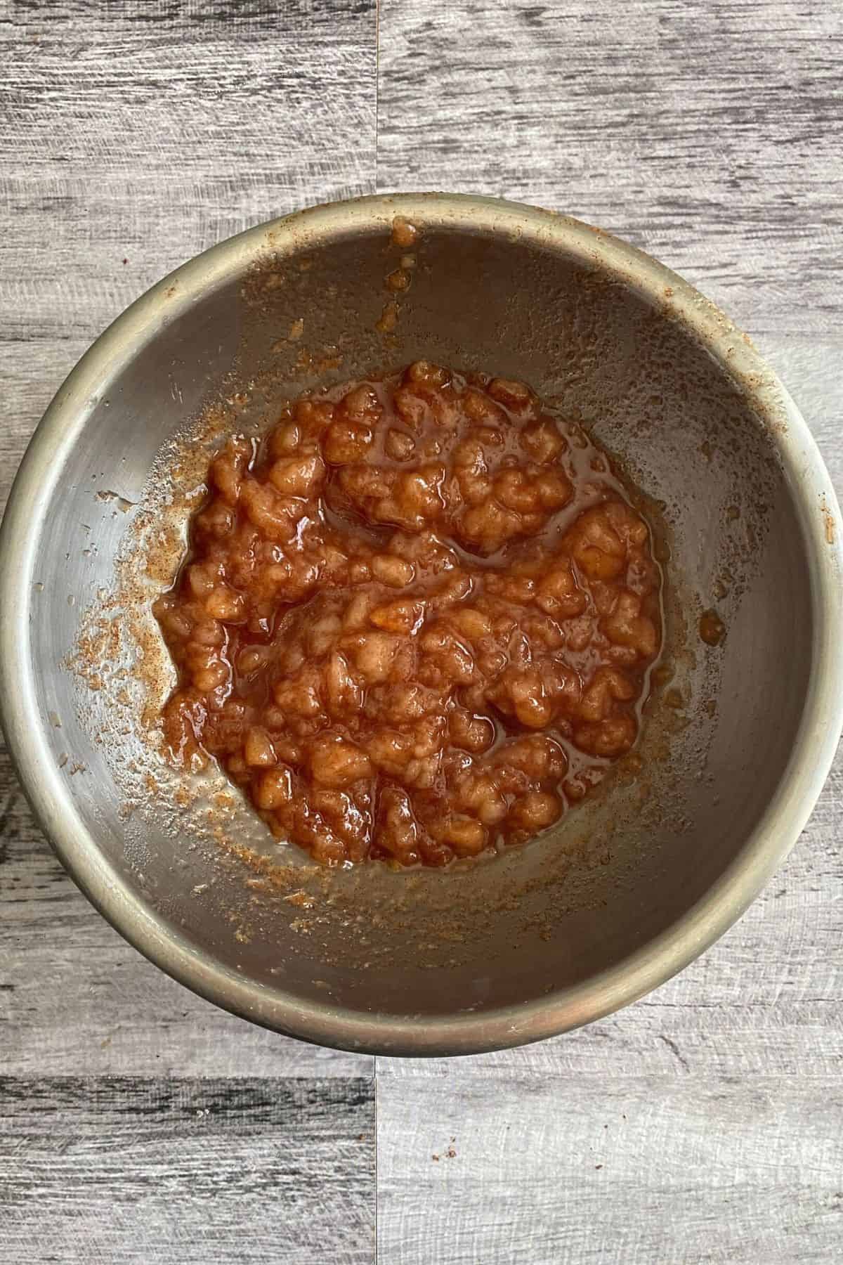 An overhead view of pear jam in a big pot