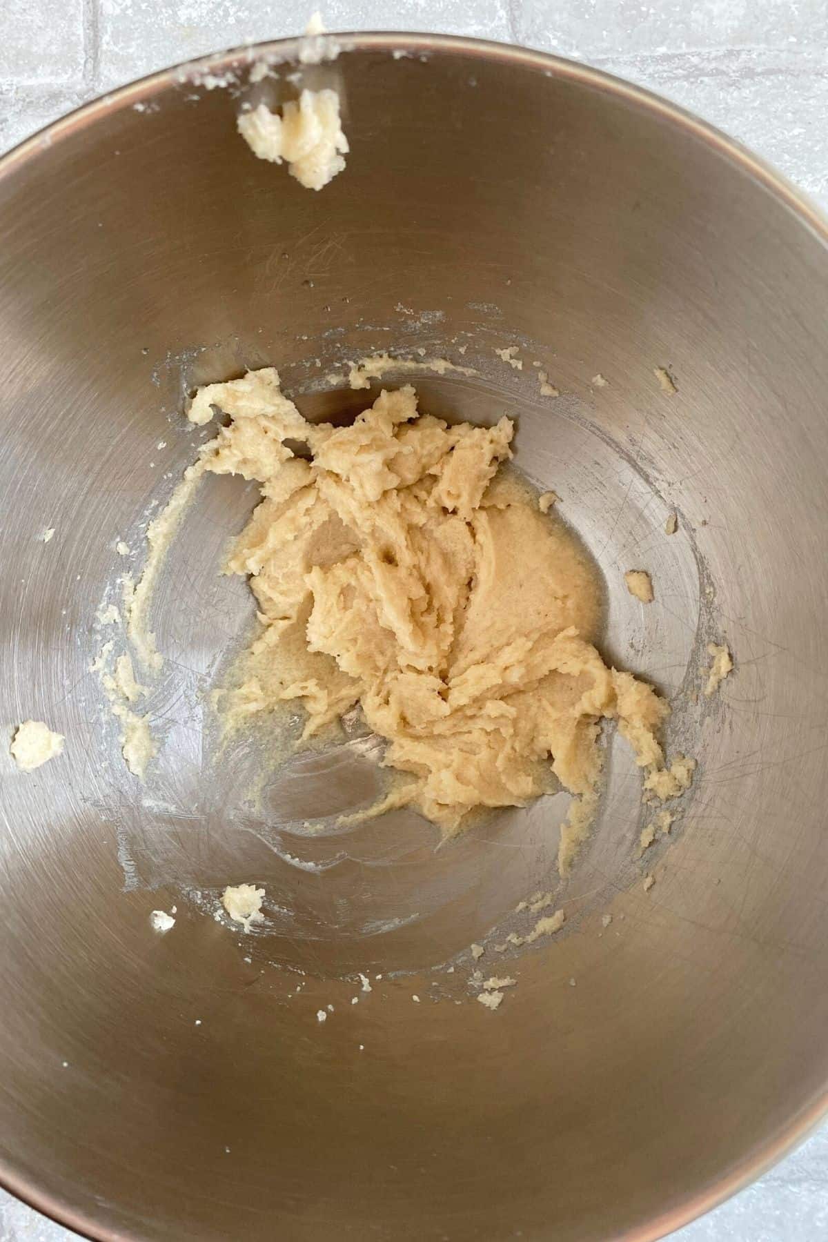 coconut oil, cream cheese alternative and sugar combined in a mixing bowl