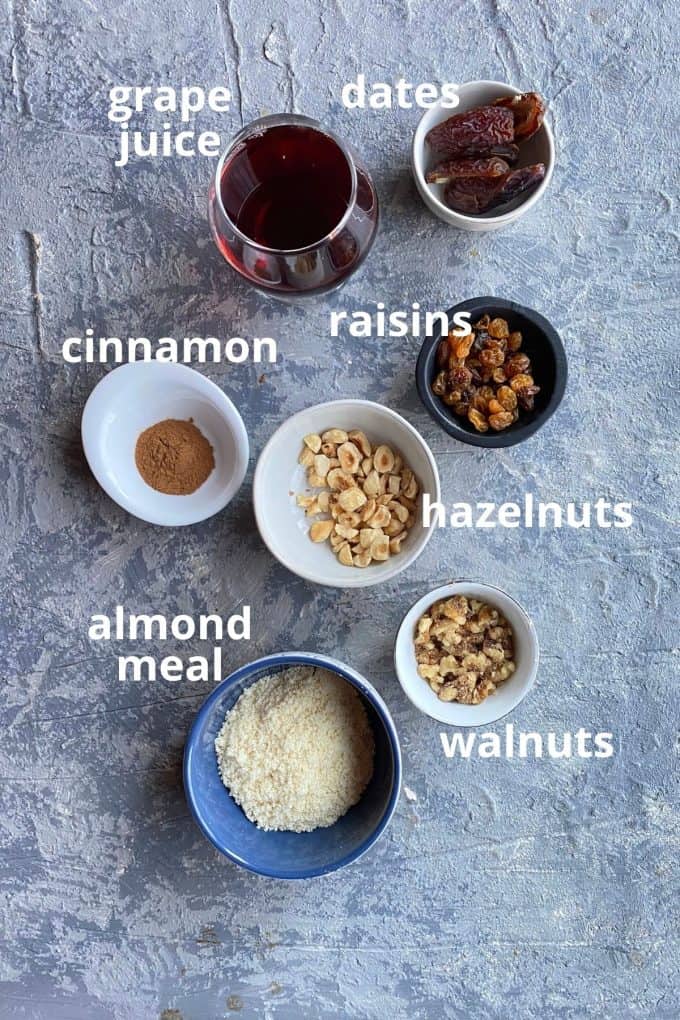 The ingredients: grape juice, dates, raisins, cinnamon, hazelnuts, walnuts, and almond meal