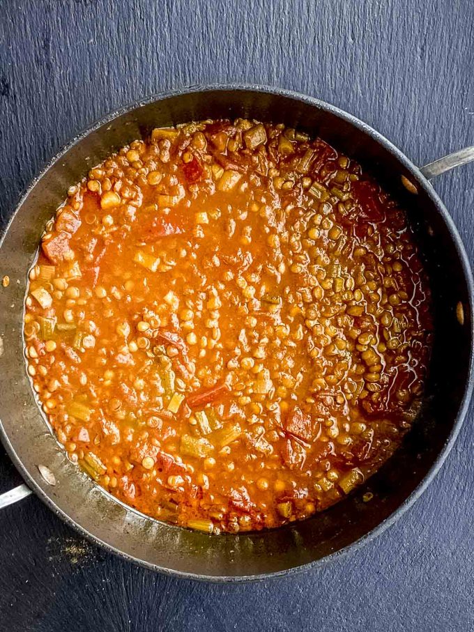 Cooking lentils in a tomato base for lentil curry