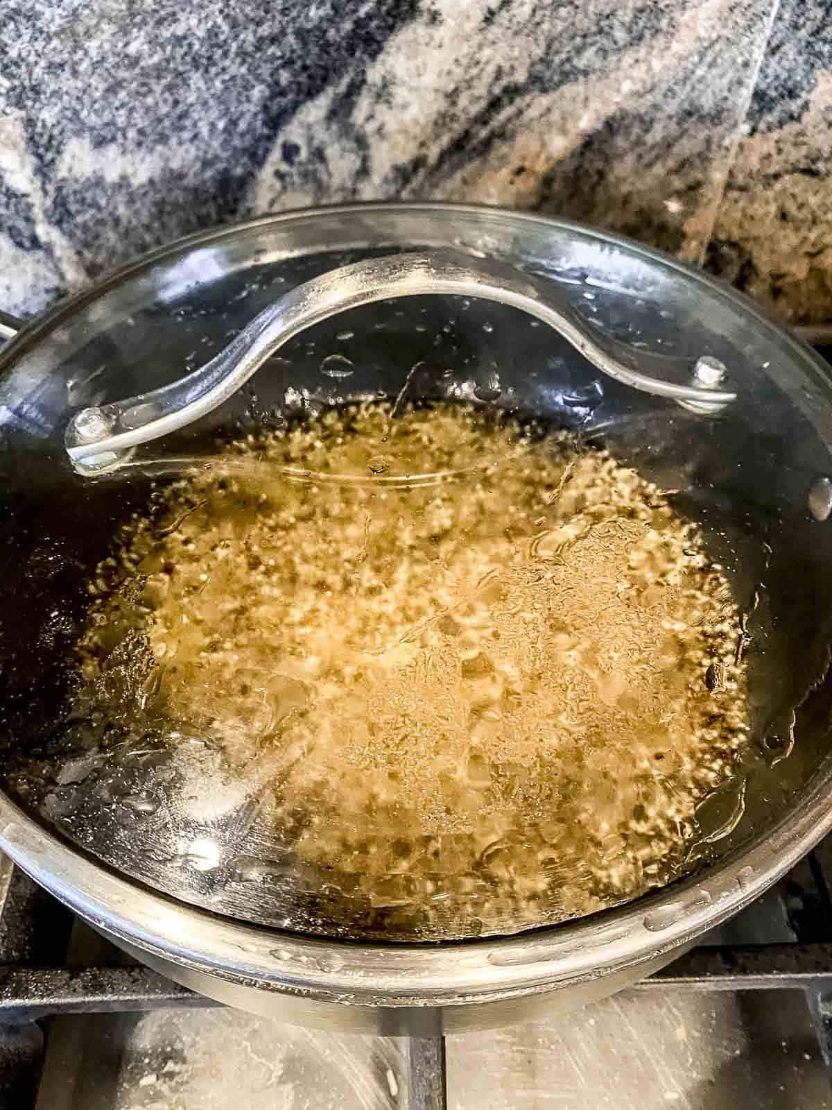 Quinoa cooking in a covered pot