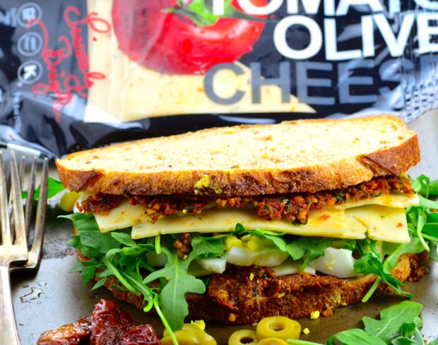 Crunchy Tomato Olive Cheese Vegetarian Picnic Sandwich - home made sundried tomato spread , crunchy multigrain sour dough bread, creamy cheese, fresh arugula and satisfying egg.