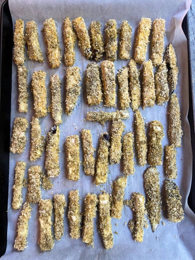 unbaked eggplant fries in a bakig sheet