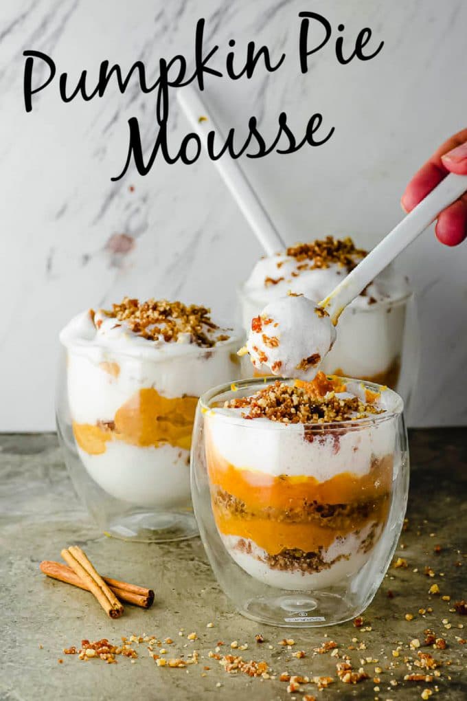 Taking a spoonful of pumpkin mousse out of a cup. With a Pumpkin pie mousse title