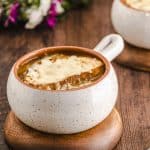 Side view of a bowl of French onion soup
