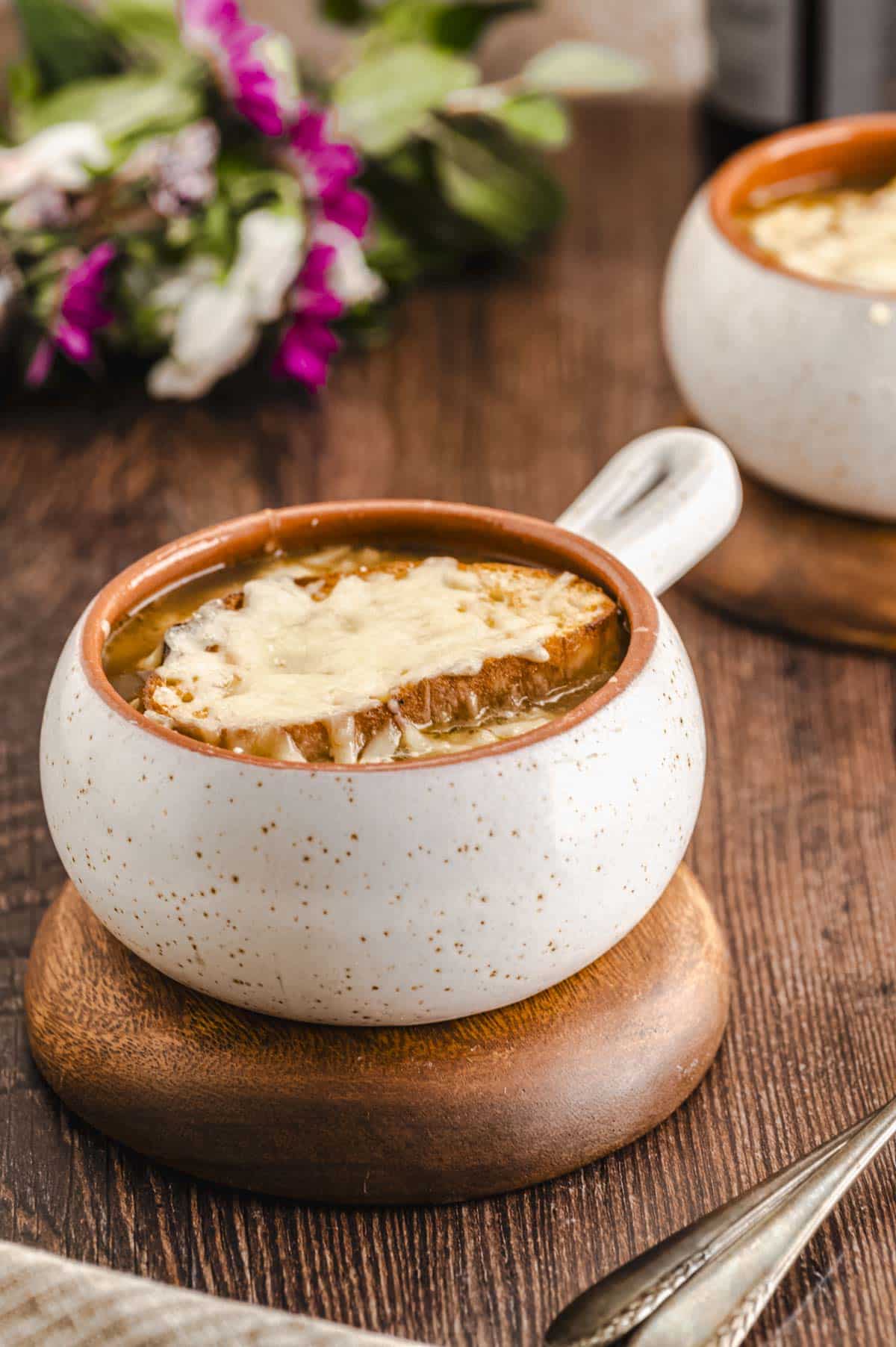 Side view of a bowl of French onion soup
