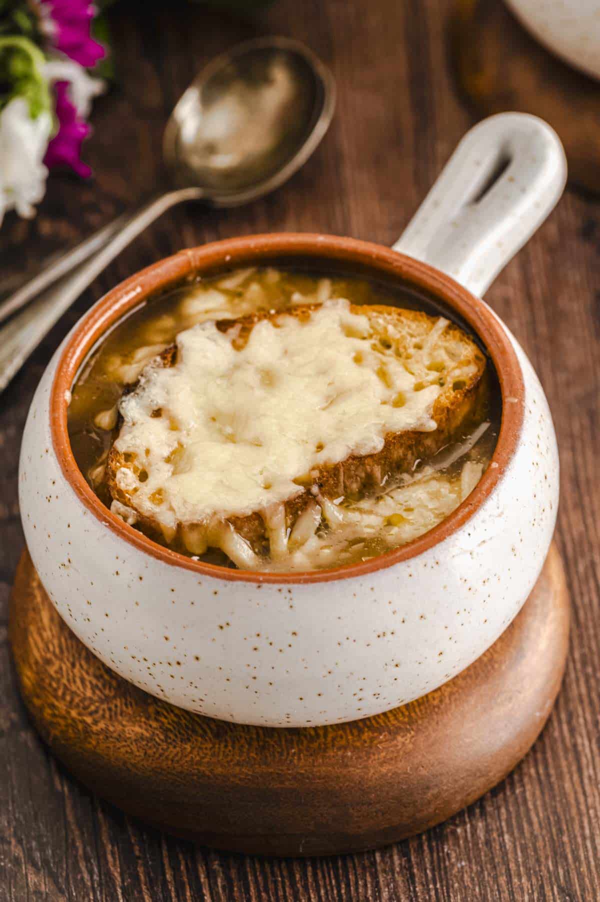 A ramekin with vegetarian French Onion soup
