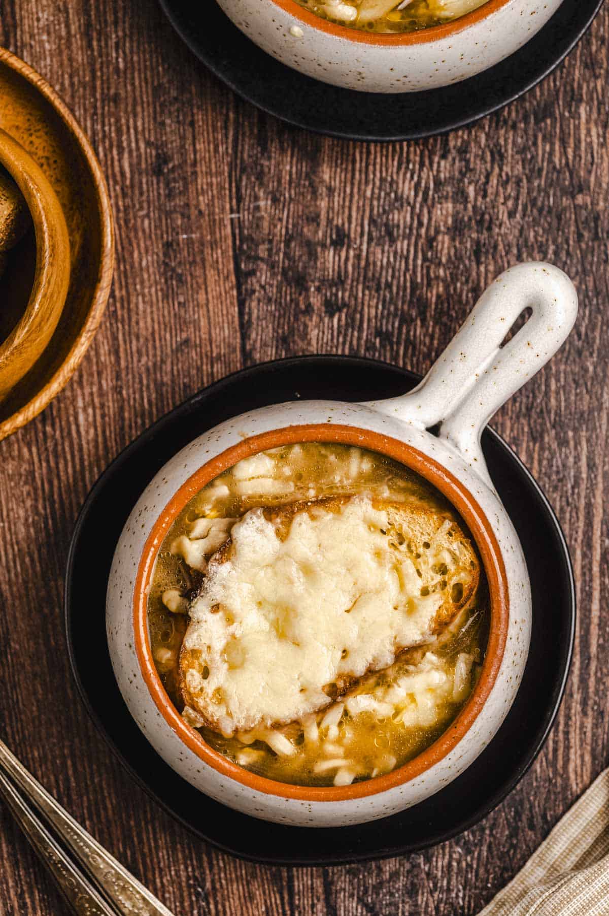 Overhead view of a bowl of French Onion Soup
