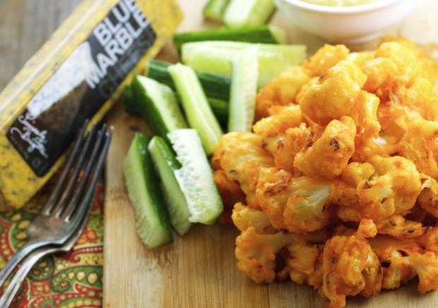 Spicy, almost guilt free, cauliflower buffalo "wings" with a creamy blue cheese sauce