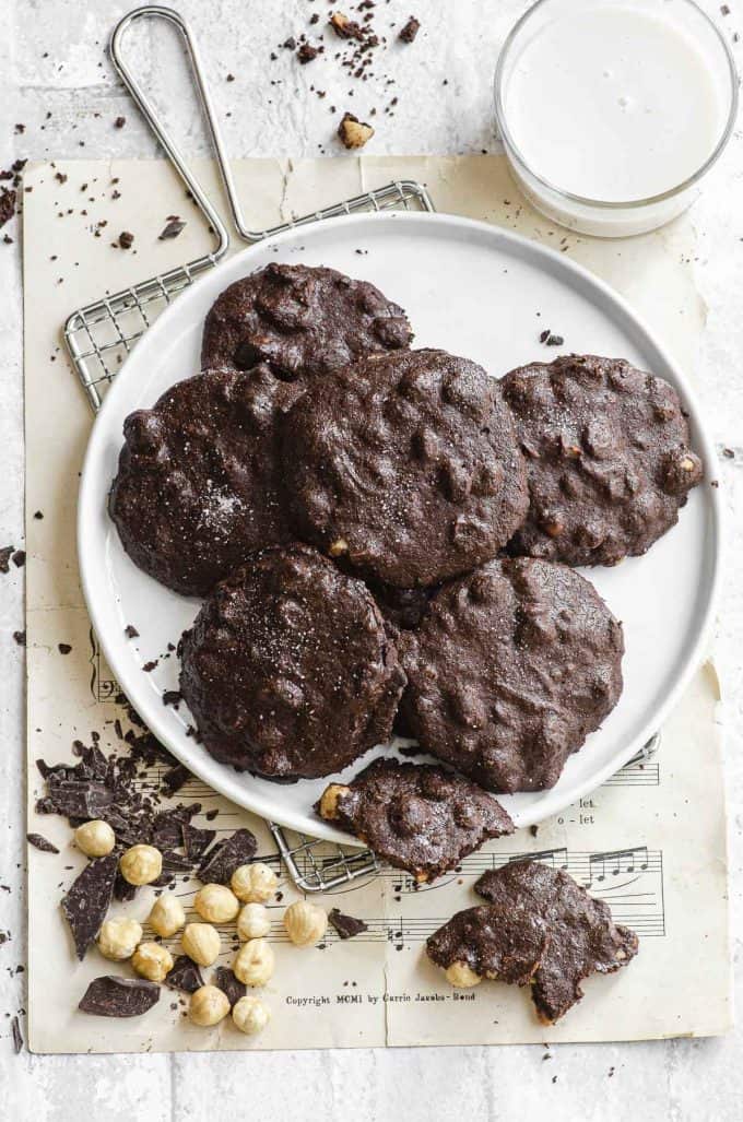 An overhead view of a plate of chocolate flourless vegan cookies