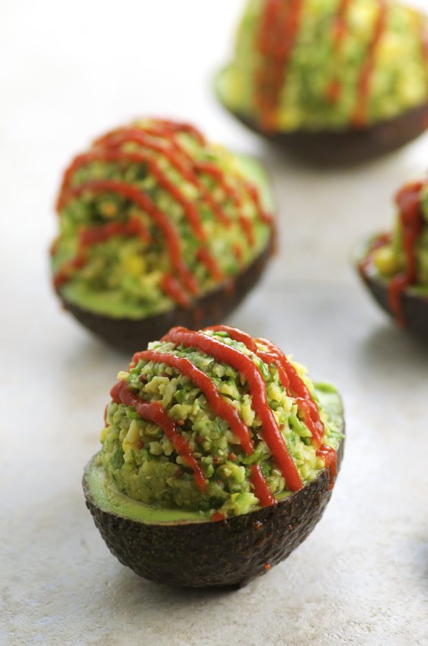 Chickpea Stuffed Avocados, drizzled with Sriracha for a nice kick. A great addition to your Meatless Monday menu this summer and all year long!