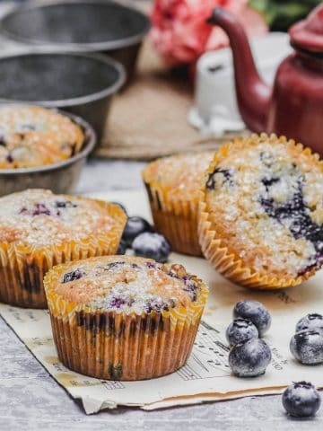 A closer view of stacked blueberry corn muffins