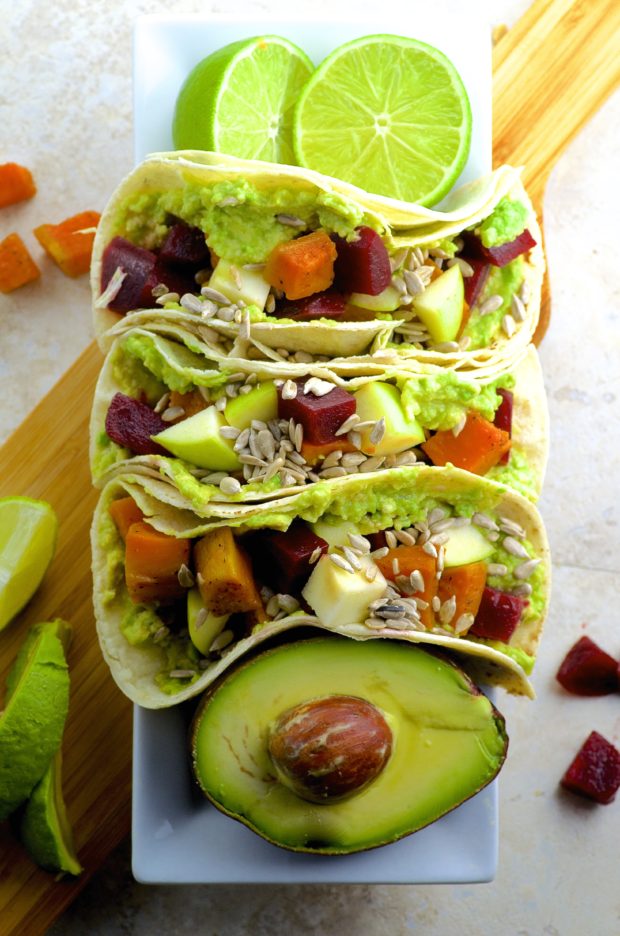 Beet And Sweet Potato Fall Tacos - Nutty Corn tortillas are topped with creamy avocado, roasted beets, sweet potatoes, crunchy apples and if you choose to spice it up drizzle sriracha all over these fall tacos.