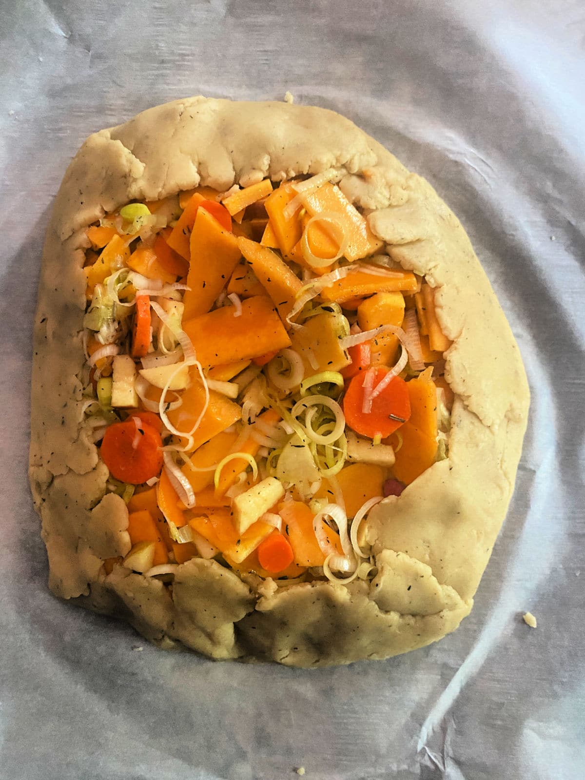 unbaked savory galette ready to go into the oven
