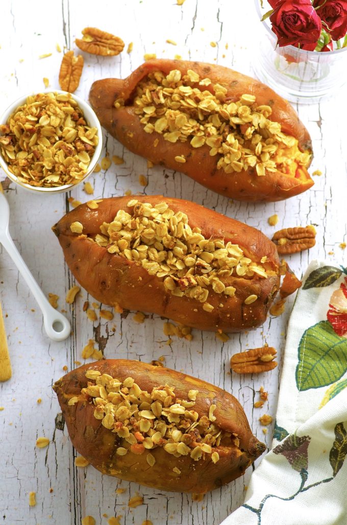 Creamy Thanksgiving stuffed sweet potatoes with a crunchy oat, maple and pecan topping. Vegan, vegetarian, Gluten Free