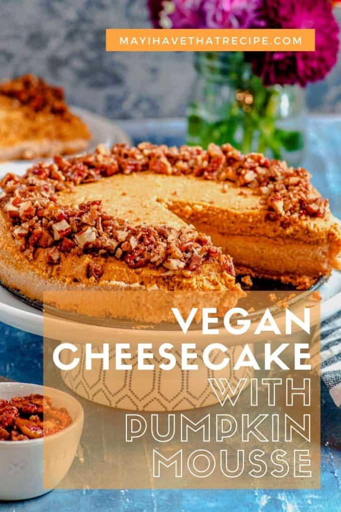 Vegan cheesecake with pumpkin mousse on a cake stand with a slice taken out