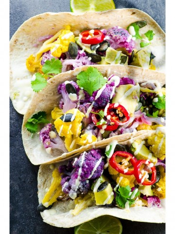 These Roasted Yellow and Purple Cauliflower Tacos are not only healthy good for you, but they are totally stunning with their popping colors, there like a rainbow on a plate.