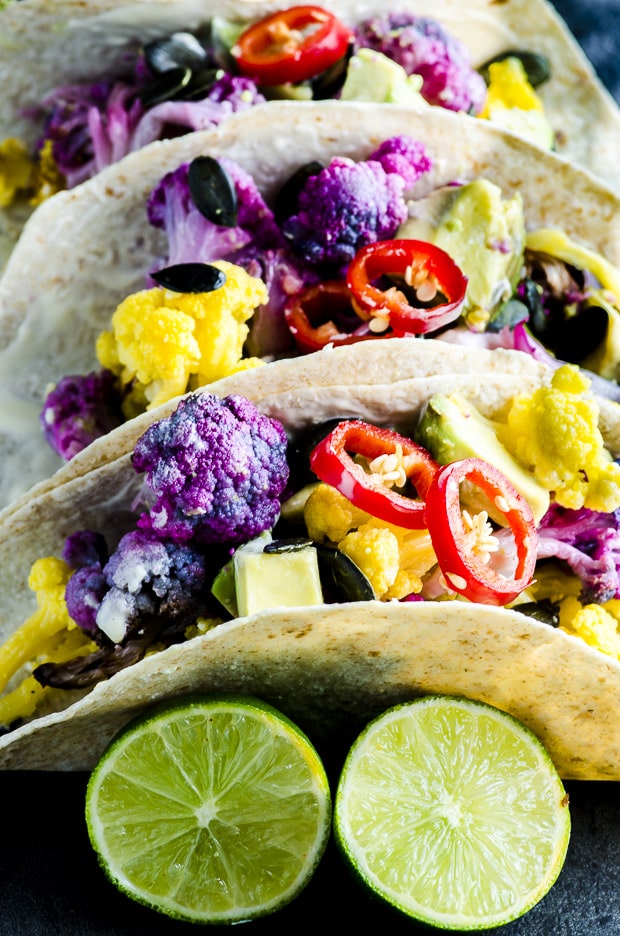 These Roasted Yellow and Purple Cauliflower Tacos are not only healthy good for you, but they are totally stunning with their popping colors, there like a rainbow on a plate.