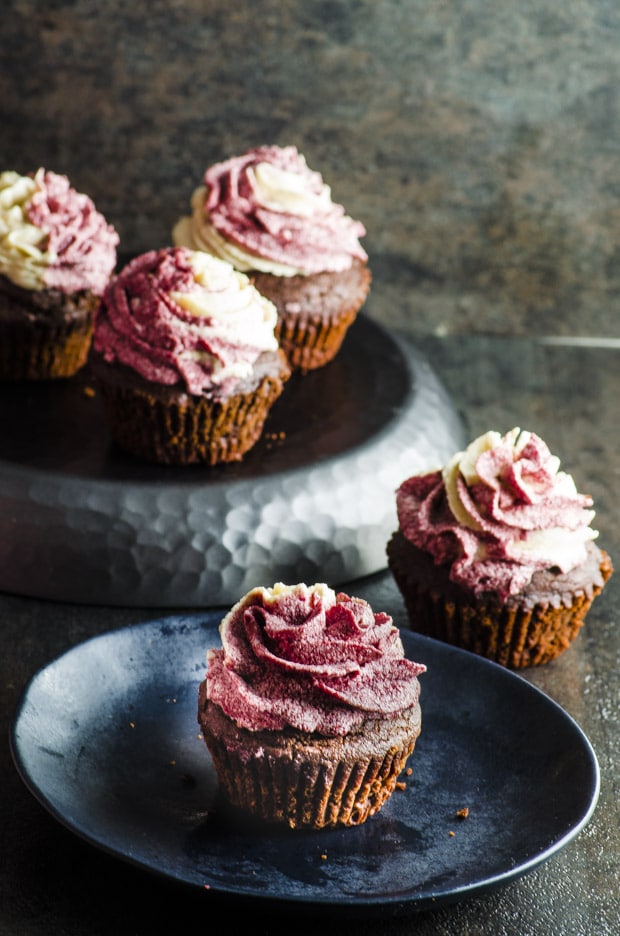Vegan Pomegranate Tahini Cupcakes - rich and moist chocolate cake topped with creamy tahini and pomegranate molasses icing.