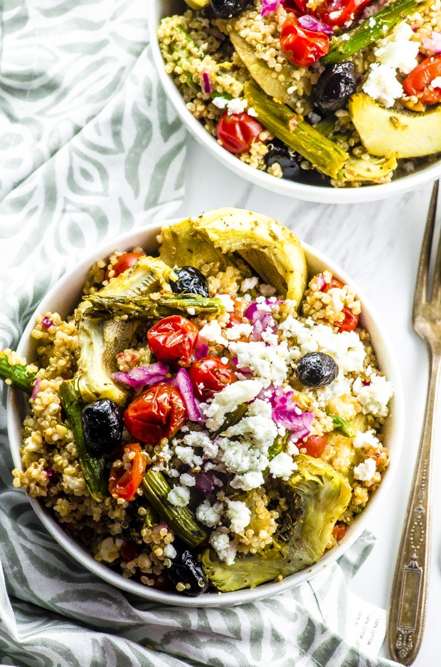 Birds eye view of two bowls of Roasted Vegetable And Quinoa Greek Salad