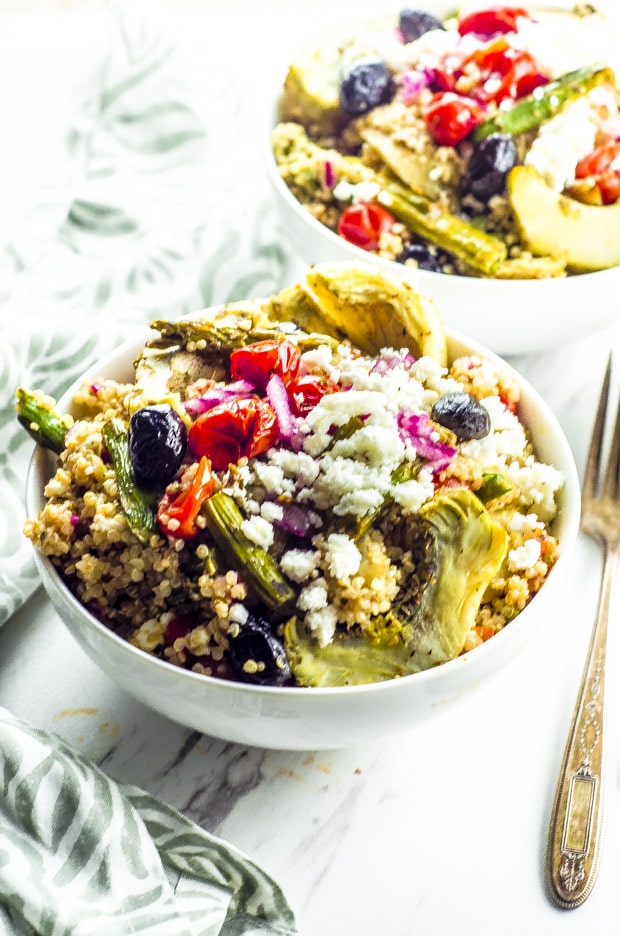 Close up of two bowls of Roasted Vegetable And Quinoa Greek Salad