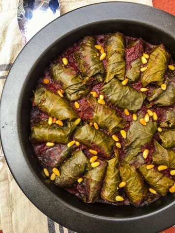 Close up view of a pan with stuffed grape leaves