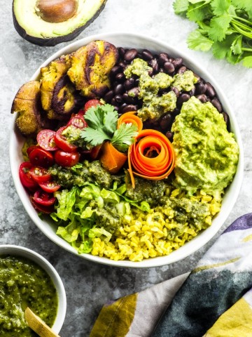 Yellow rice burrito bowl with tostones and tomatillo salsa - great Mexican inspired recipe - vegetarian, vegan , gluten free