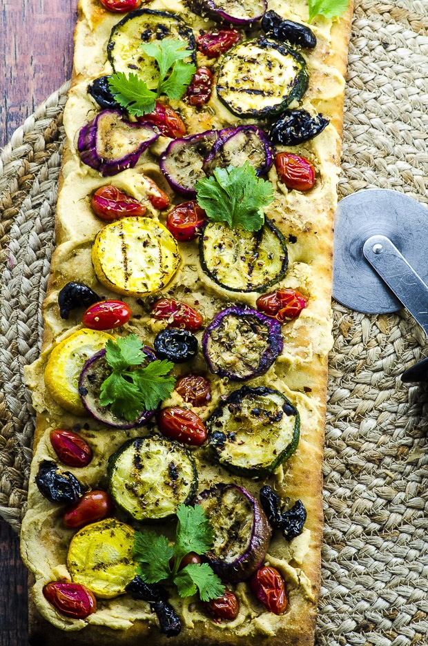 For this Hummus and Grilled Vegetable Pizza recipe, we marinated zucchini, yellow squash and Japanese eggplant in olive, lemon, garlic, coriander, cumin and ginger.  We spread a store bough crust with our home made hummus, instead of cheese for a healthy twist.