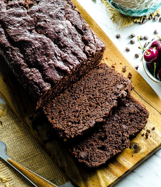 Bird's eye view of a vegan chocolate cake with some slices cut