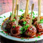 Side View of a plate with veggie meatballs on toothpicks