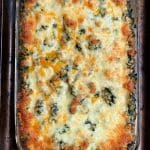 Overhead view of a baking dish with spinach pasta bake