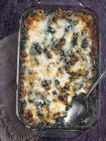 overhead view of a rectangular baking sheet with creamed spinach pasta bake