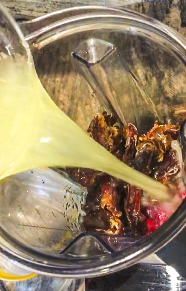 dates, raspberries and lemon in a high power blender